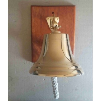 Brass bell 25cm on wood backing.