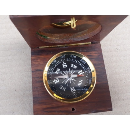 Compass fitted in rose wood box.