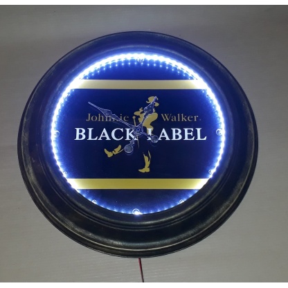 Johnnie Walker illuminated clock. 58cm diameter.
