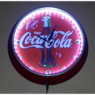 Coca-cola illuminated metal clock. 31cm diameter.